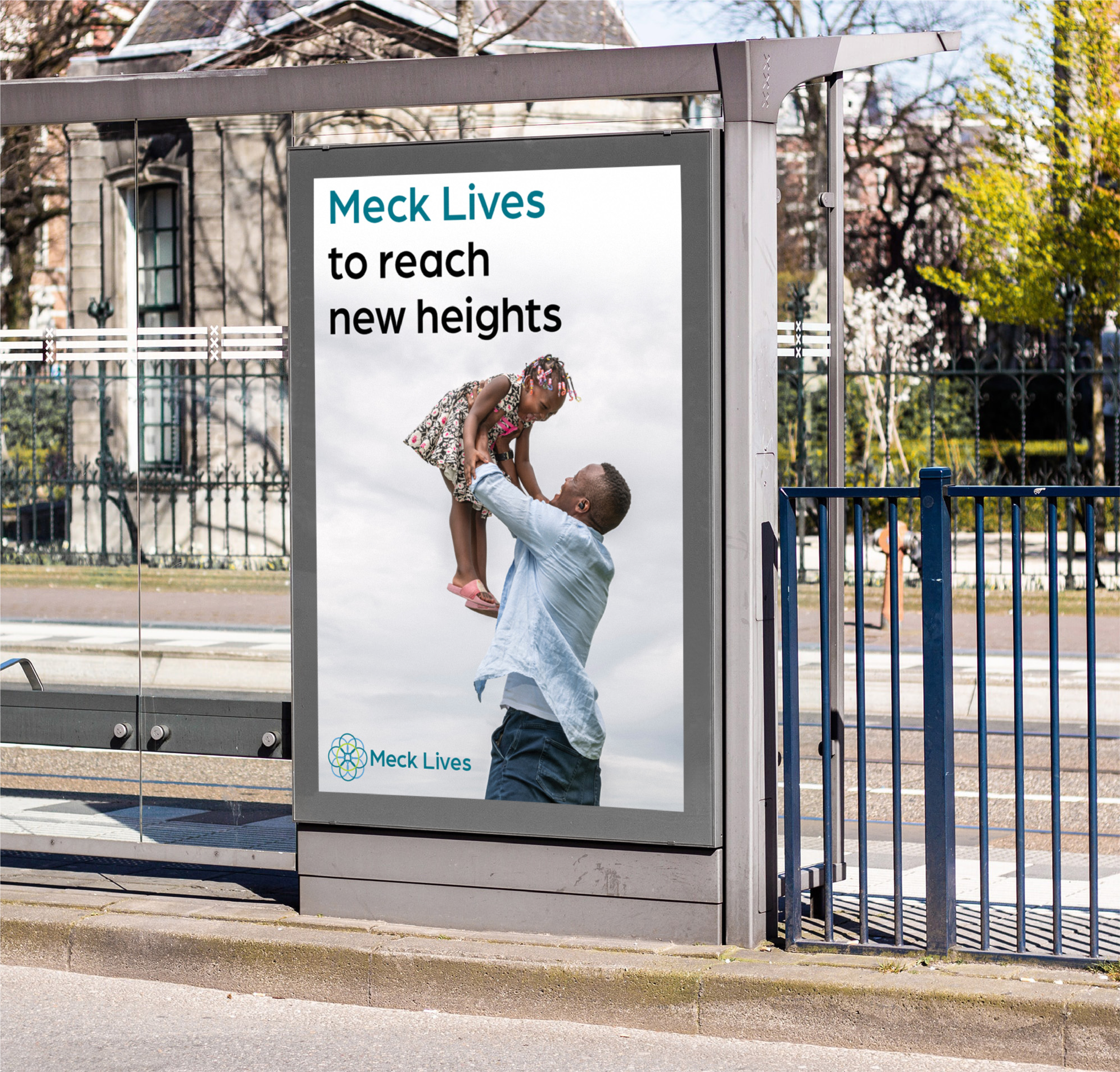 An image of a mockup of a bus stop poster featuring a Meck Lives campaign ad